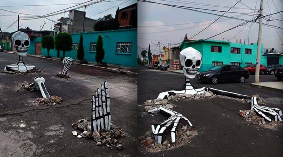 Habitantes colocan calaveras gigantes para tapar baches en las calles